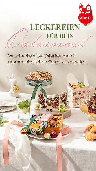 Social-Media Motiv von Lebkuchen Schmidt mit verschiedenen Ostersüßigkeiten wie Schokofiguren und Pralinen auf einem festlich gedeckten Tisch.